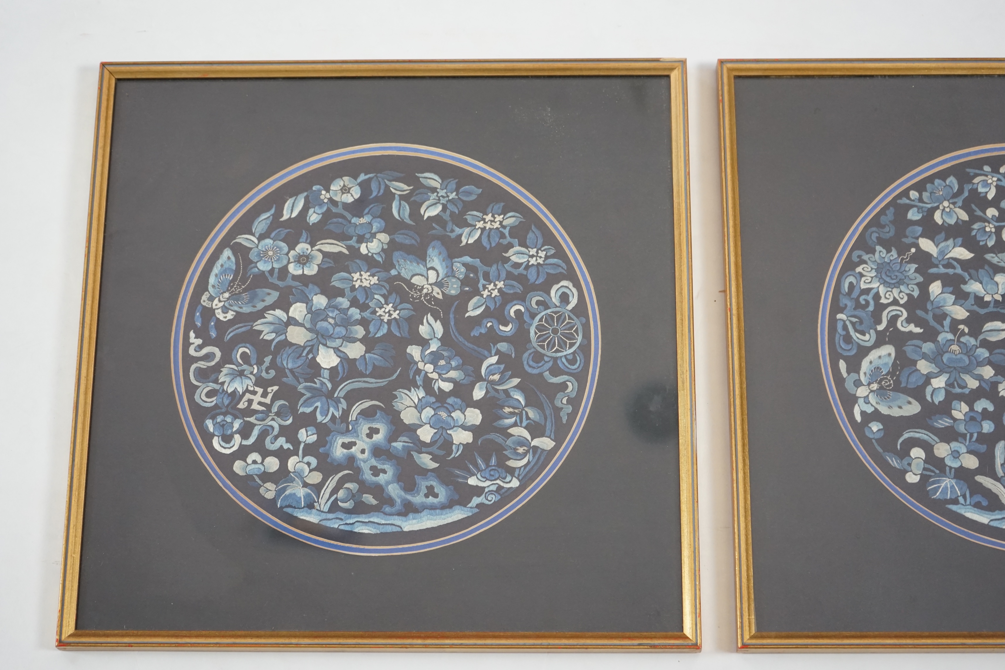 A pair of Chinese embroidered silk roundels, mid 19th century